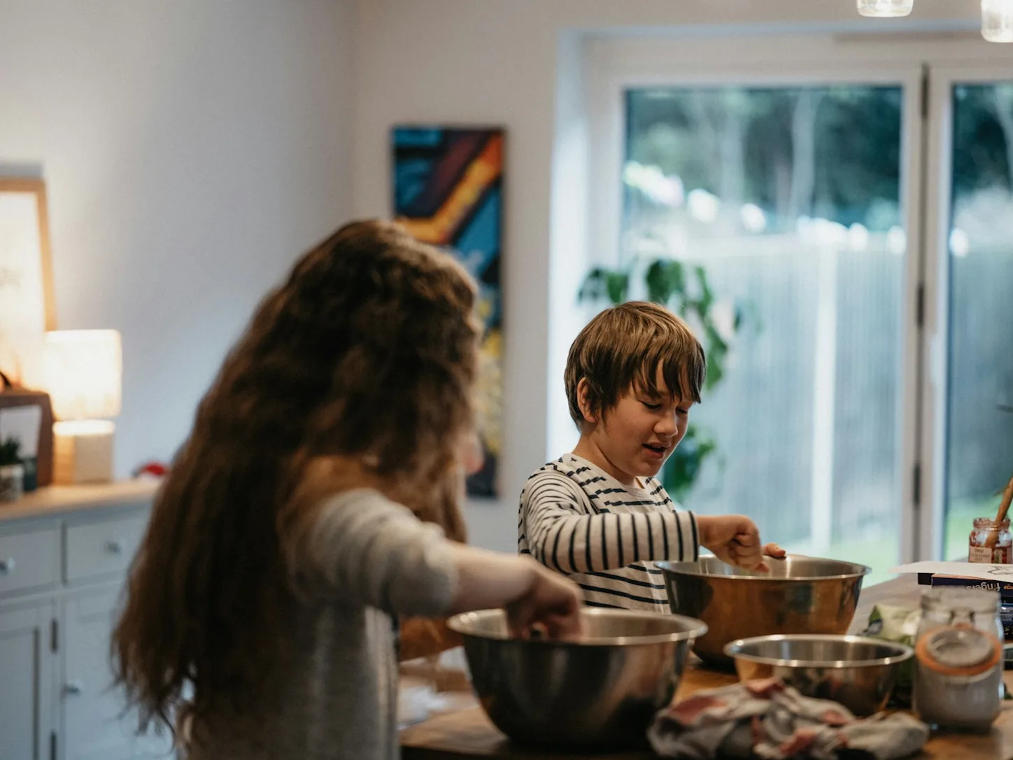 Children mixing ingredients together during a baking activity