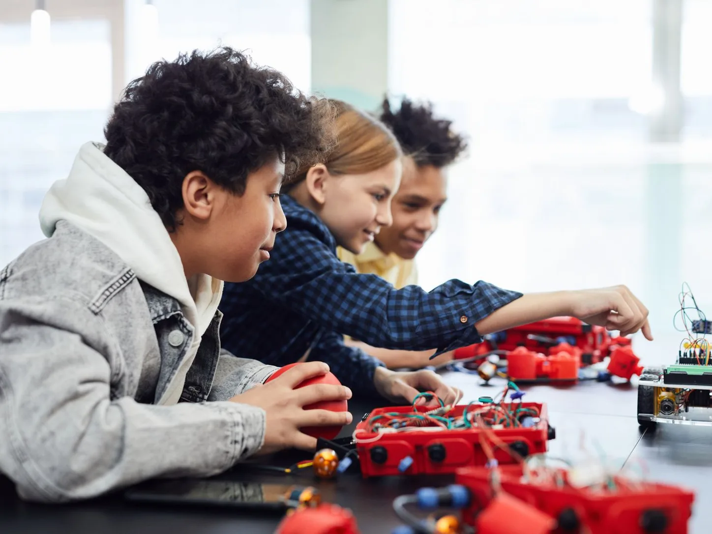 Children working together on a small robotics project